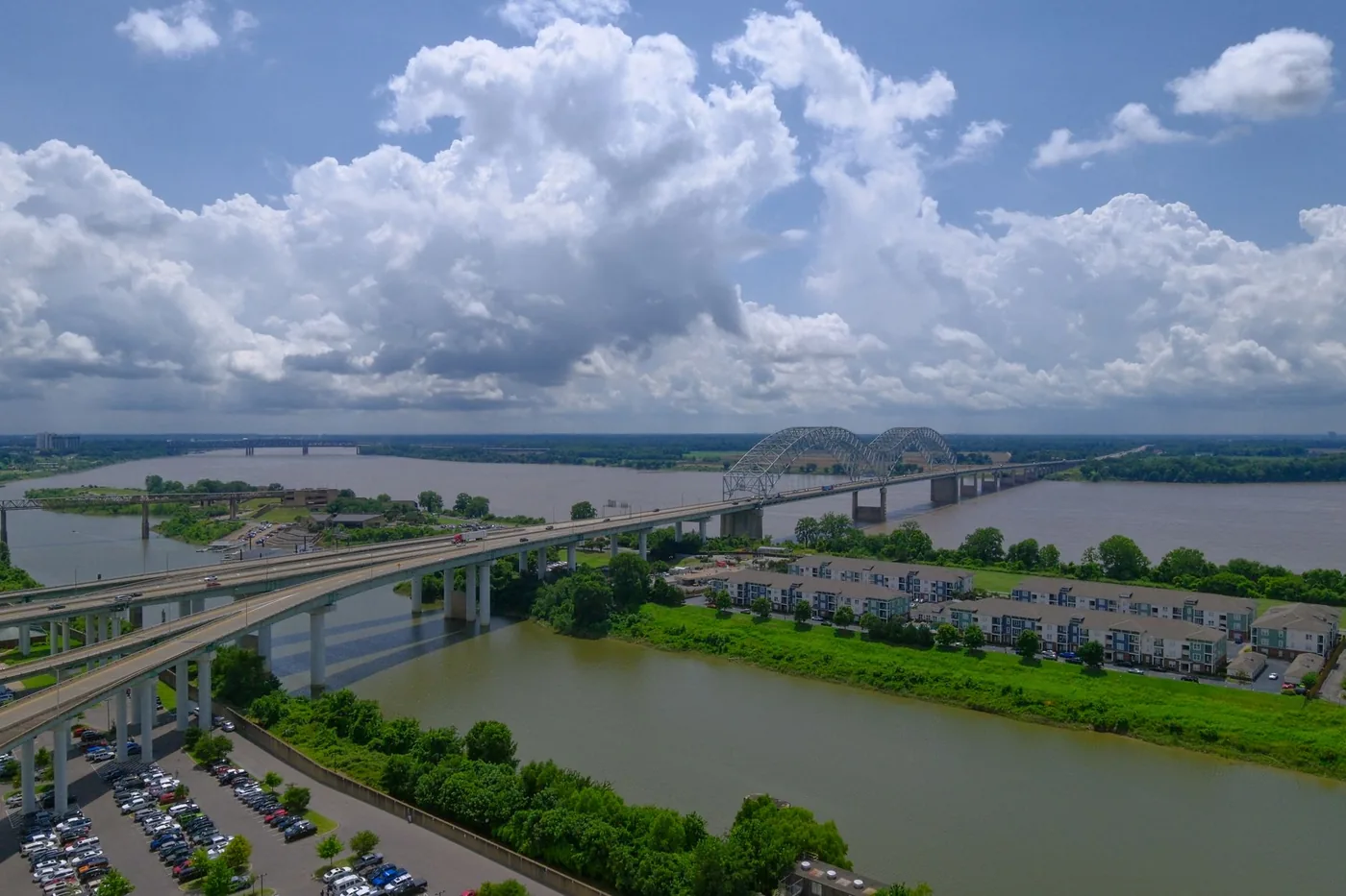 Scenic aerial view of the Hernando de Soto Bridge over the Mississippi River in Memphis, TN on a summer day.