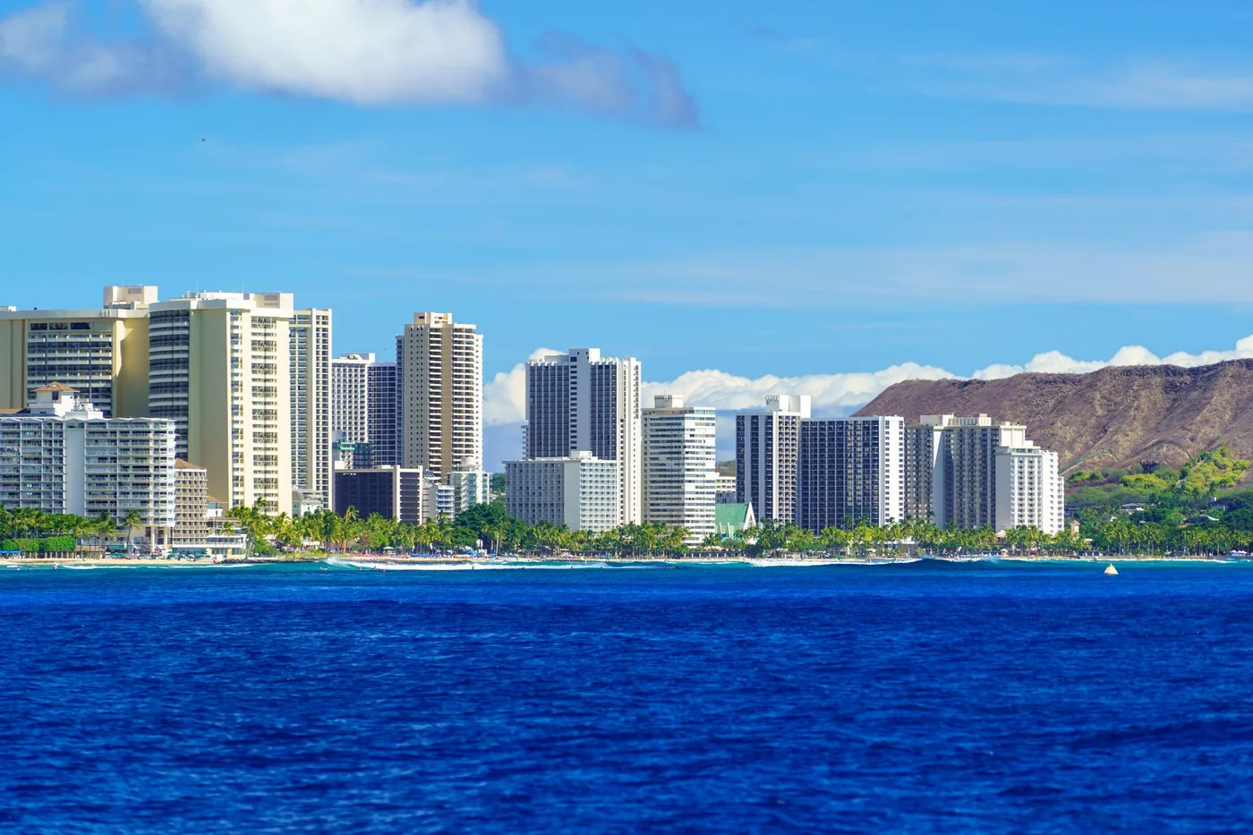 Stunning view of Honolulu skyline with Diamond Head crater and ocean.