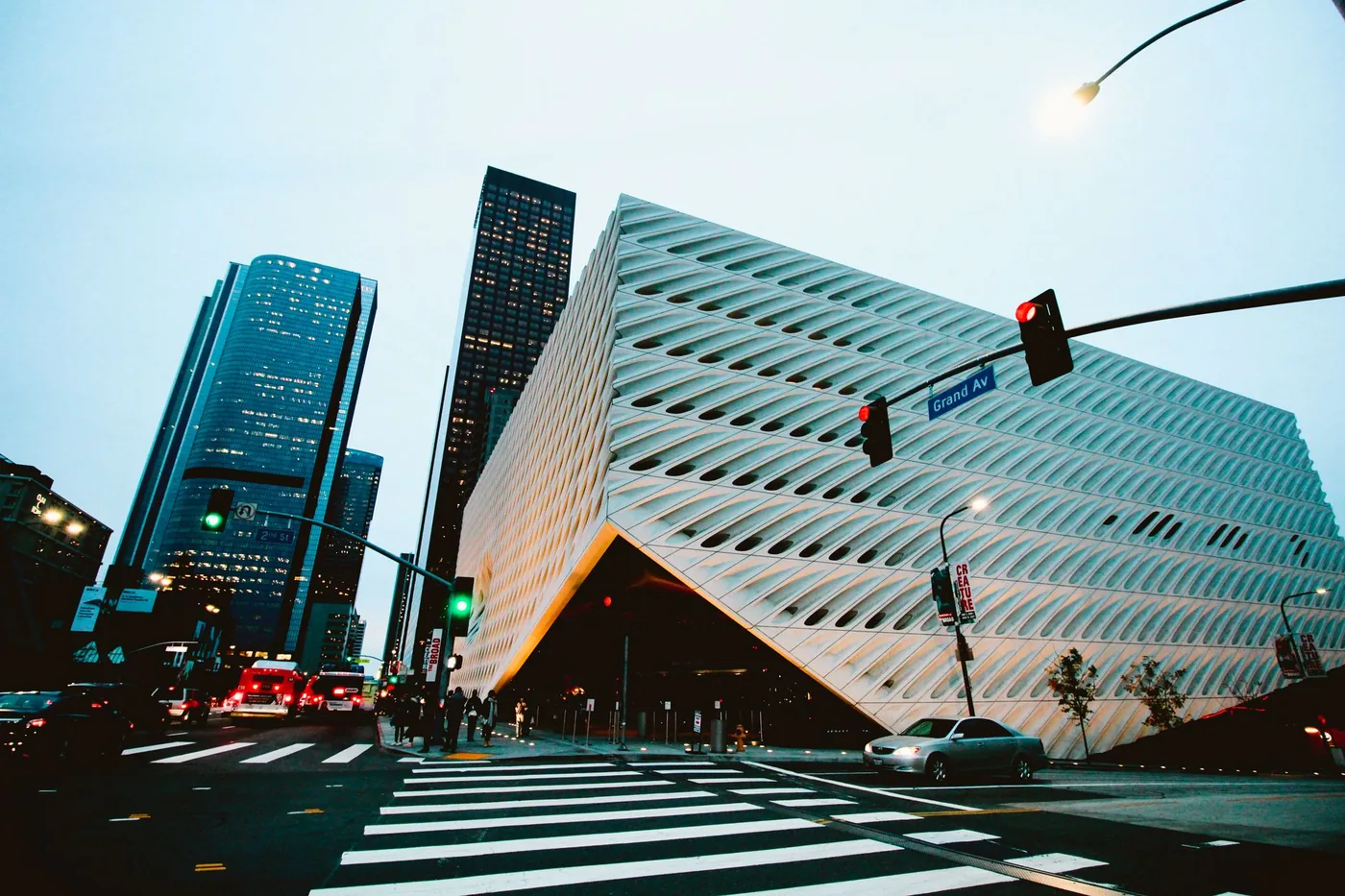 Explore Los Angeles architecture with futuristic buildings and city traffic captured at dusk.