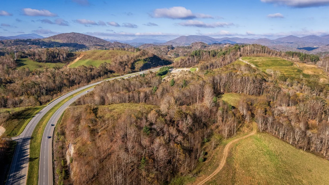 Aerial view of a winding highway through the Appalachian Mountains in North Carolina.