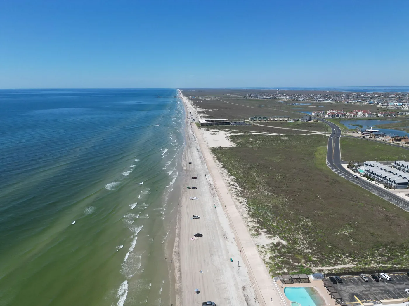 Stunning aerial photograph showcasing Corpus Christi's picturesque coastline and azure ocean.