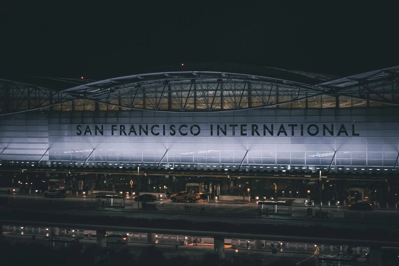 Dramatic nighttime view of the illuminated facade at San Francisco International Airport.