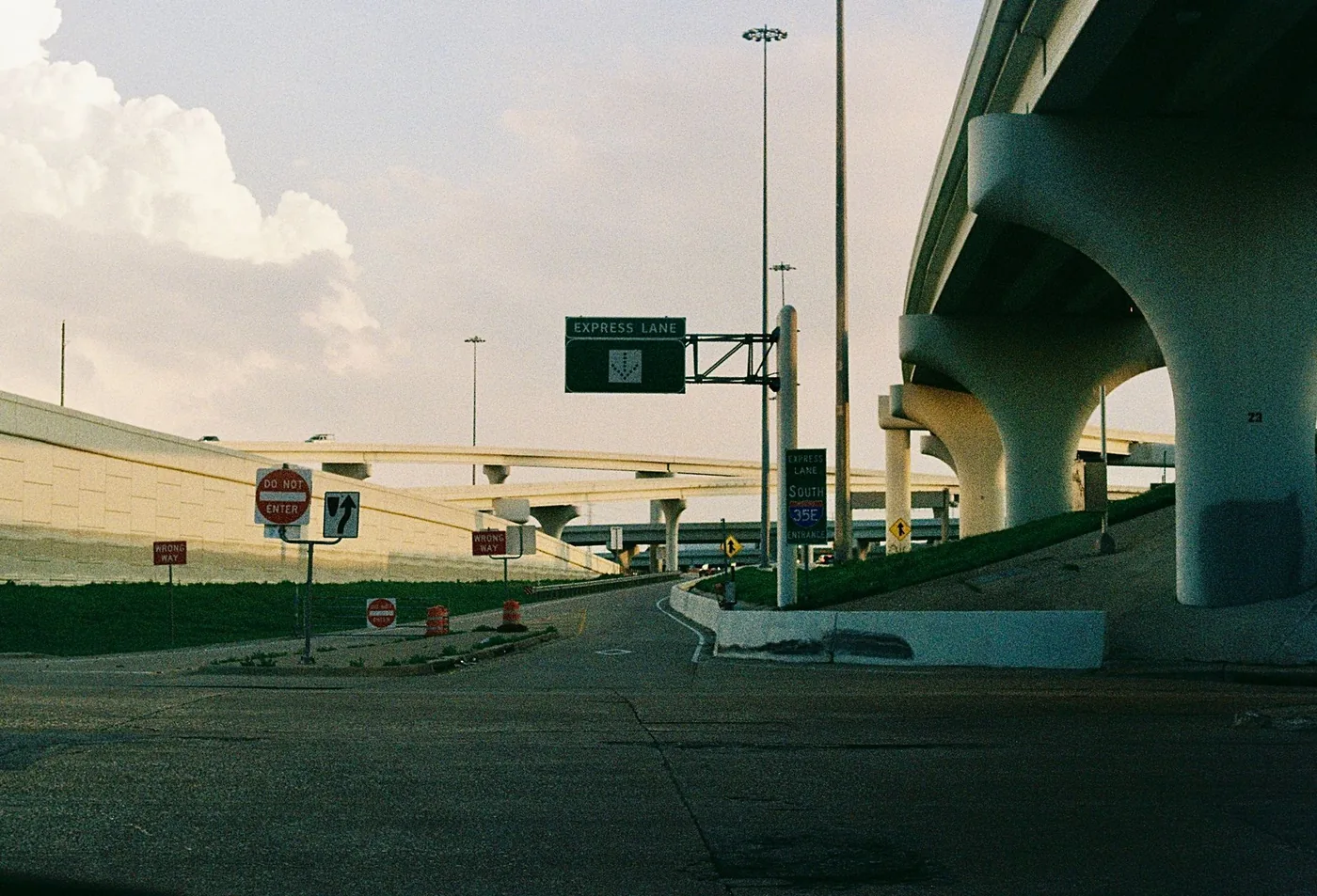 An expressive low-angle view of highways and overpasses in Dallas, showcasing urban structure.