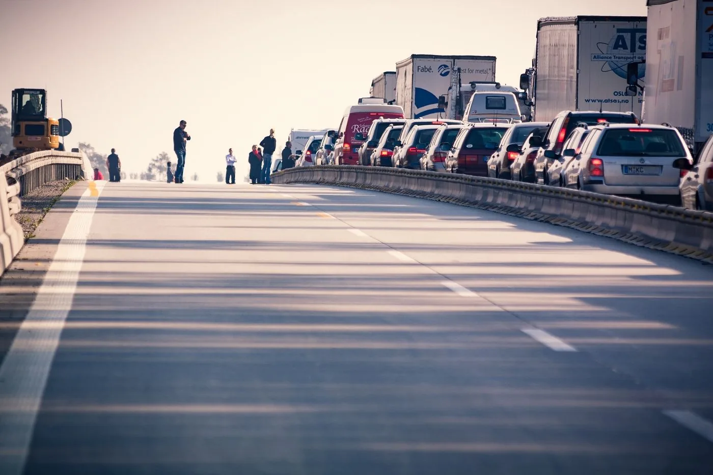 Congested multi-lane highway with dense traffic during daylight.